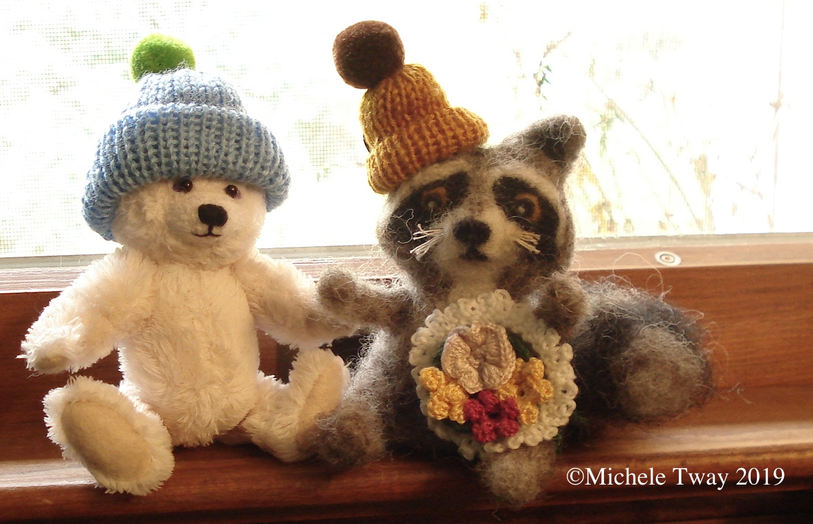 Carol's hats on Michele's bear and racoon